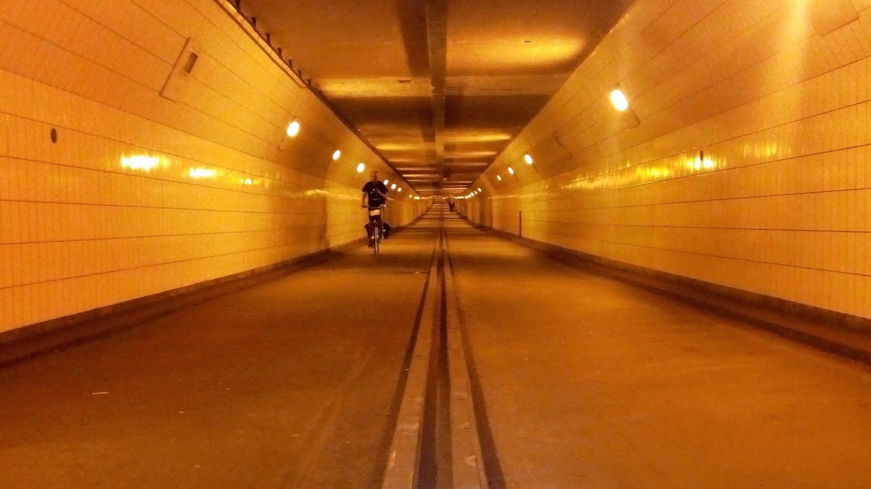 Inside the cycling tunnel. Kerb separates directions for cyclists.