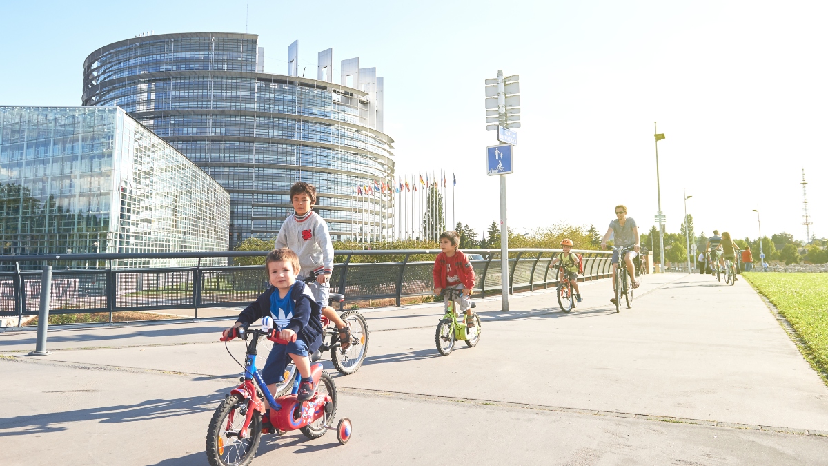 People cycling in front of the European Parliament in Strassbourg. 